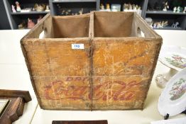 A mid century wooden Coca Cola advertising crate.