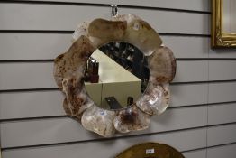 A wall mirror having shell frame.
