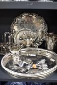 An assorted collection of silver plated ware, to include an egg cruet stand, galleried drinks trays,