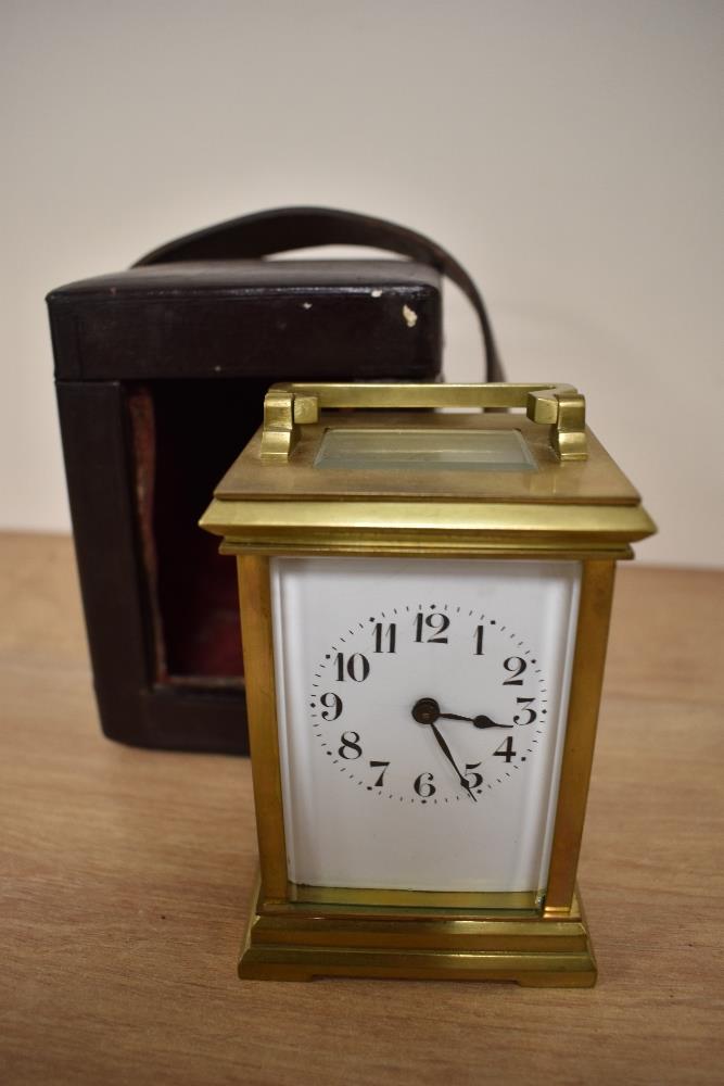 A 19th Century French brass carriage clock, having an enamelled Roman dial, with four glass case,