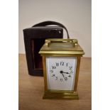 A 19th Century French brass carriage clock, having an enamelled Roman dial, with four glass case,