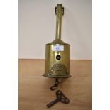An early 19th Century brass roasting jack, John Linwood Warranted, with key, measuring 26cm tall
