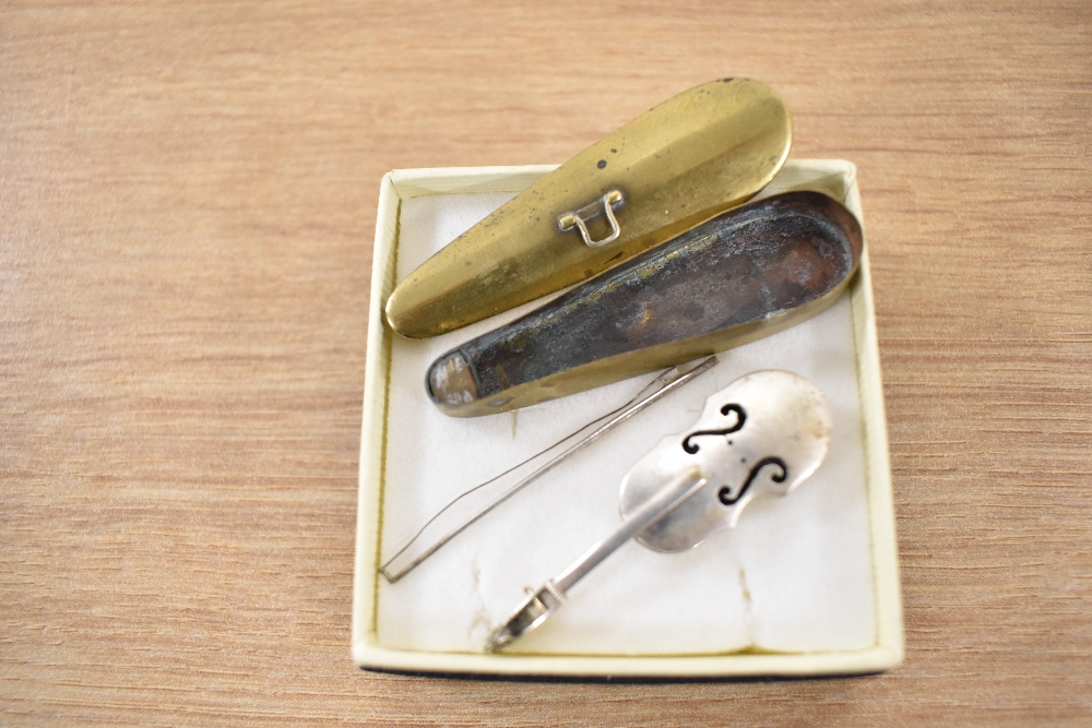 A novelty white metal cello with bow, measuring 6cm long, contained within a yellow metal case - Image 2 of 2