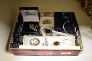 An assortment of costume jewellery including statement necklaces, a cameo brooch with a faux pearl