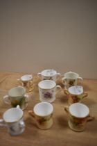 A collection of 19th/20th Century Royal Worcester porcelain tyg and loving cups, the largest