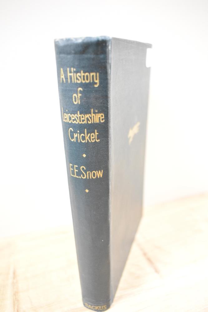 A Book; A history of Leicestershire cricket, by E Snow, with inscription to first page and dated