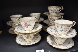 A collection of 19th Century continental porcelain teacups and saucers, hand decorated in a