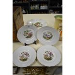 A continental porcelain comport decorated with exotic birds on cream ground, sold together with four