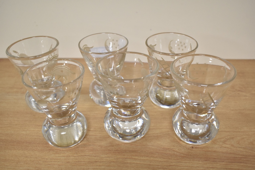 A group of six lead crystal firing or cocktail glasses, having etched design, each measuring 9cm