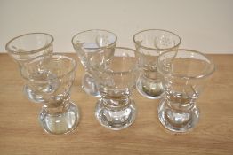 A group of six lead crystal firing or cocktail glasses, having etched design, each measuring 9cm
