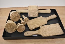 A selection of wooden butter moulds and butter pats