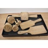 A selection of wooden butter moulds and butter pats