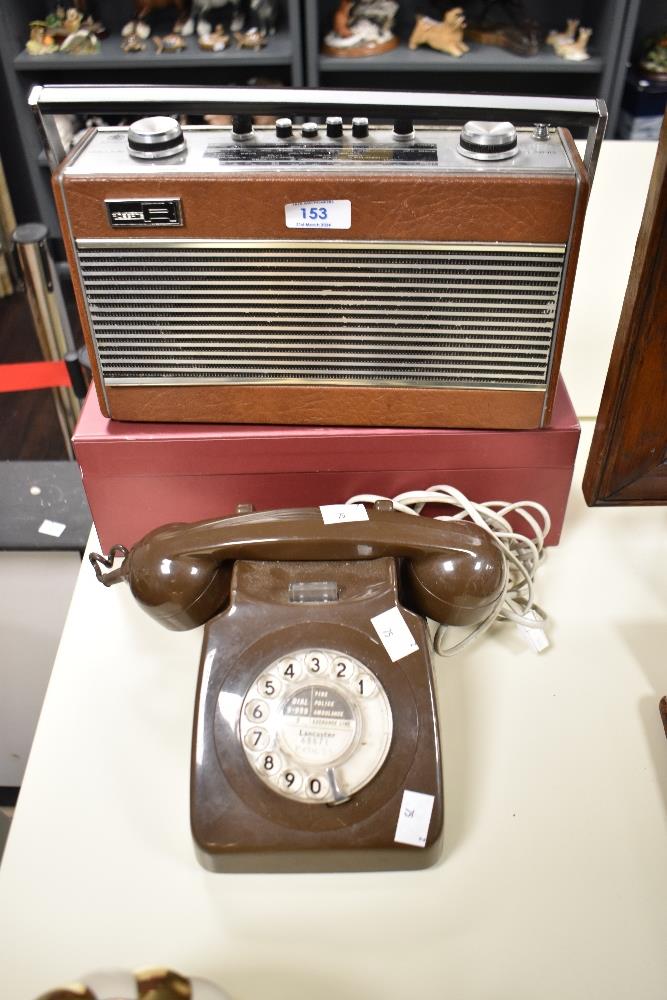 A Vintage Brown plastic rotary telephone.