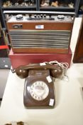 A Vintage Brown plastic rotary telephone.