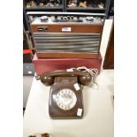 A Vintage Brown plastic rotary telephone.