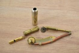 An early 20th Century brass and copper boatswain whistle, of maritime interest, together with