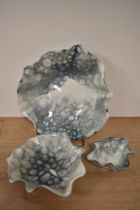 Three Deborah Brett ceramic dishes, decorated in her signature 'bubble glaze', the largest