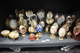 A selection of trinket boxes, most of egg shaped form, also included are some ornamental scenes