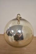 A vintage chromed metal Witches ball, measuring 12cm in diameter