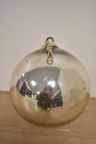 A vintage chromed metal Witches ball, measuring 12cm in diameter