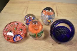A selection of paperweights, including 20th century Chinese paperweight with multiple canes