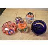 A selection of paperweights, including 20th century Chinese paperweight with multiple canes