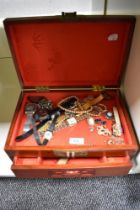 A large Chinese style wooden jewellery box containing a variety of costume jewellery including Casio