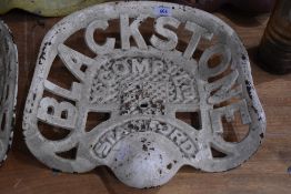 A vintage agricultural implement cast metal seat from Blackstock Compy Ltd, Stamford