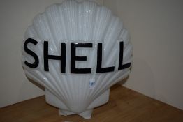 A vintage Shell glass globe as found