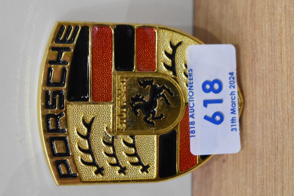A Porsche car badge