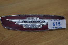 A Jensen car badge