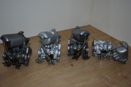 Four sets of 1.5in twin carbs. 1 as found