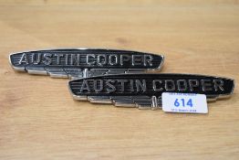 Two Austin Cooper car badges
