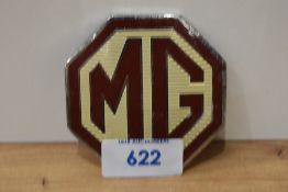 An MG car badge