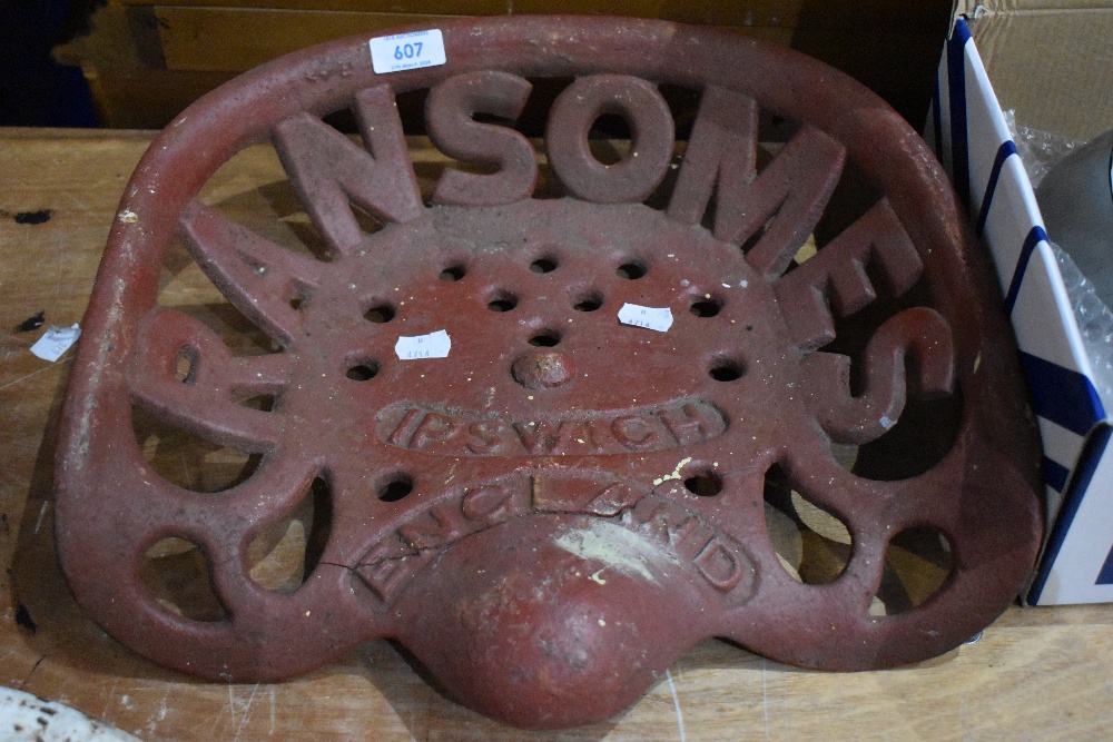 A vintage agricultural implement cast metal seat from Ransomes, Ipswich England. Slight crack to