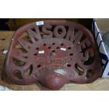 A vintage agricultural implement cast metal seat from Ransomes, Ipswich England. Slight crack to