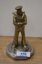 A vintage brass Sailor car mascot