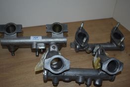 Three vintage manifolds