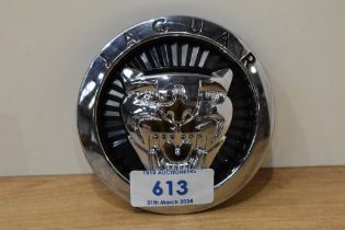 A Jaguar car badge