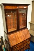 An early 20th Century walnut burea bookcase of small proportions