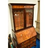 An early 20th Century walnut burea bookcase of small proportions