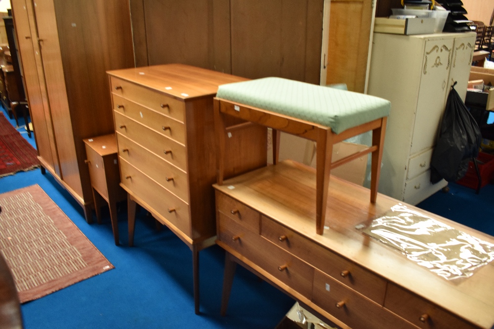 A vintage bedroom suite labelled AC (Alfred Cox) bleached walnut , comprising wardrobe, dressing