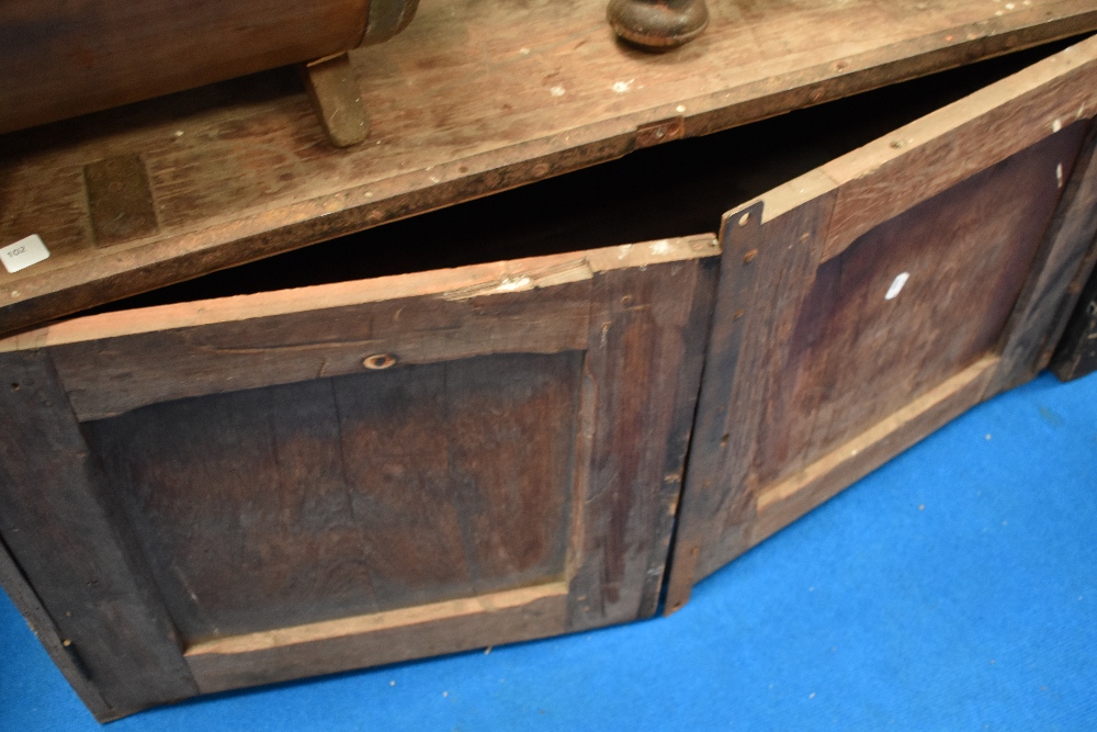 A vintage storage chest having doors to front, and metal reinforcing width approx. 106cm