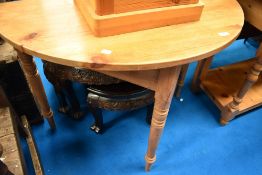 A natural pine demi lune hall table on turned legs, width approx. 102cm
