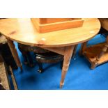 A natural pine demi lune hall table on turned legs, width approx. 102cm