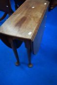 A late 19th or early 20th Century mahogany occasional table having oval top and cabriole gate leg,