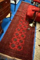 A Persian style carpet runner having red ground, approx 260 x 80cm