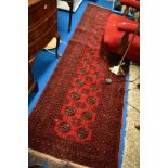 A Persian style carpet runner having red ground, approx 260 x 80cm