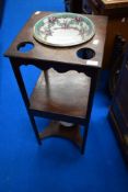 A Georgian mahogany night stand having later jug and bowl set