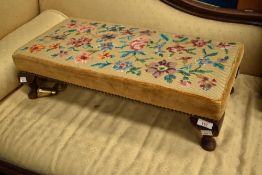 A woolwork footstool having foliate design , approx 63 x 30cm